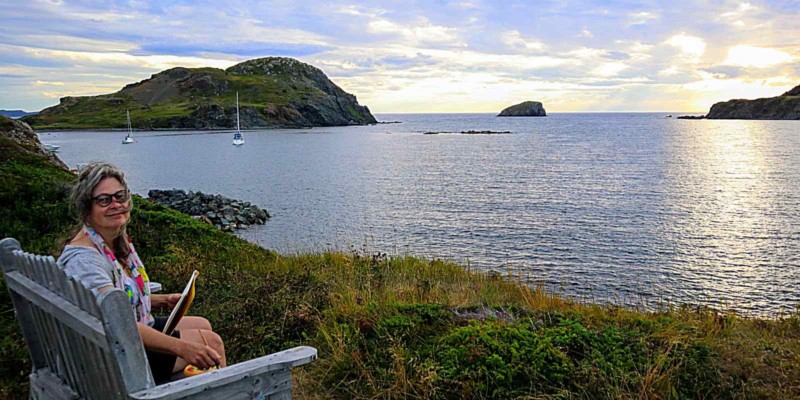 Irene Duma sketching a seascape, in Twillingate Newfoundland