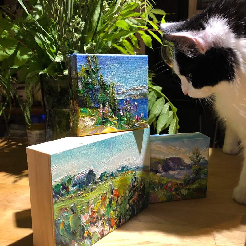 three mini paintings by Irene Duma, and a cute cat