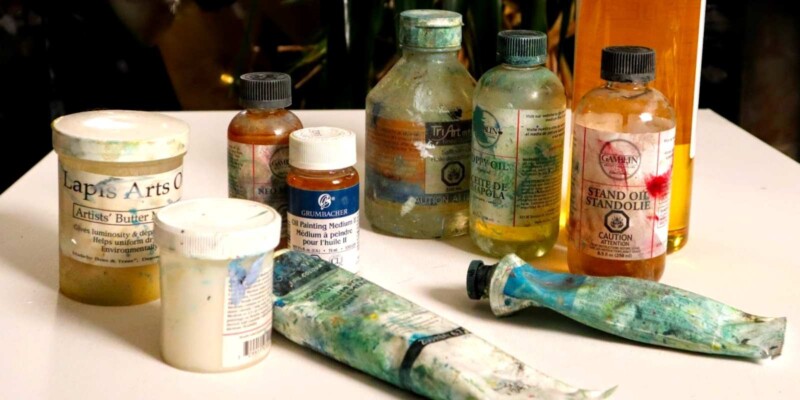 this is an image of different oil paint mediums on a table.