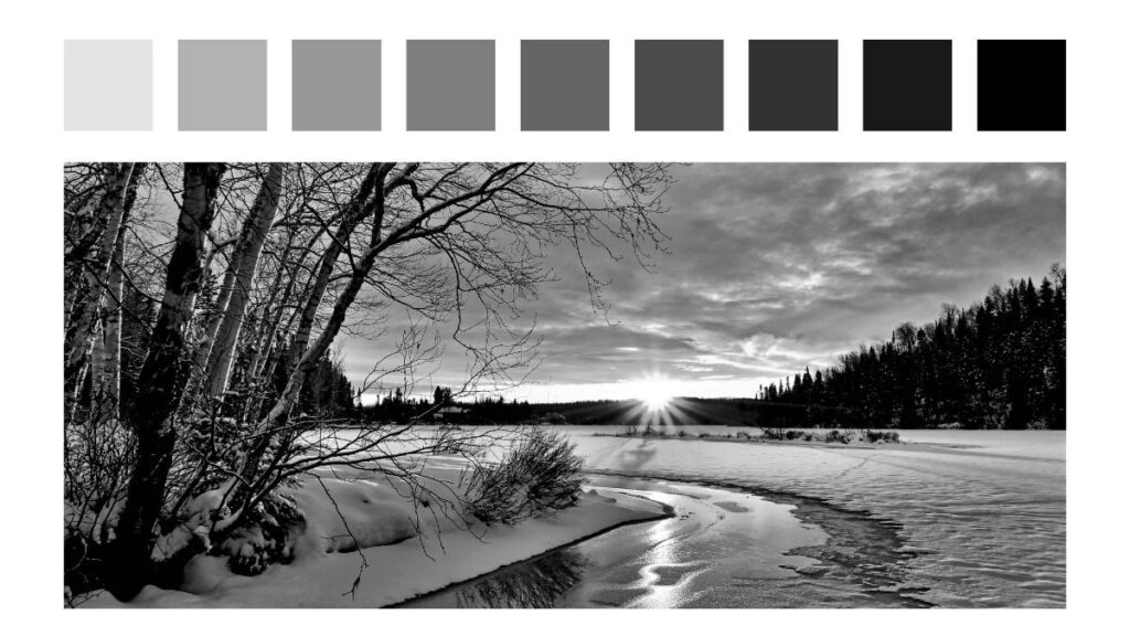 a black and white painting of a river, and 9 squares of paint from lightest grey to black